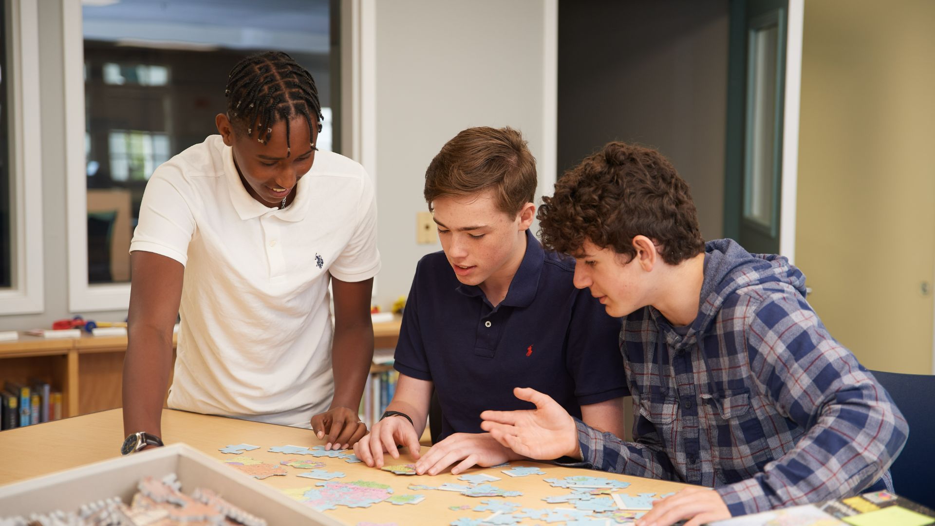 photo of students working on a puzzle