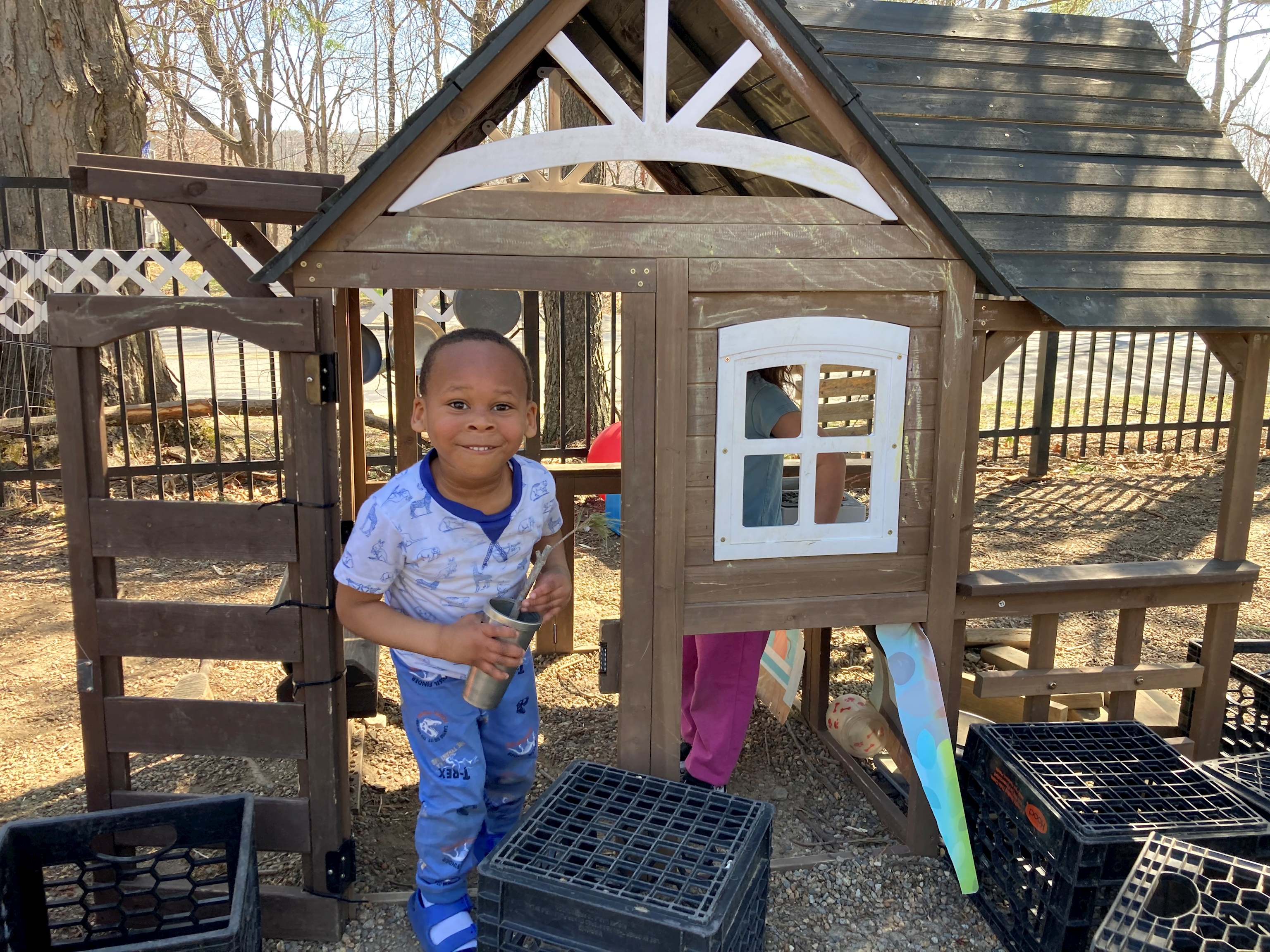 Photo of boy in tree garden playhouse